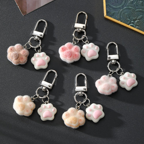 Five dual cat paw keychains with flocked and resin paws in mixed colors