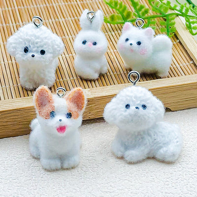 Multicolor rabbit charms arranged on a light background