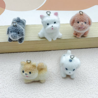 Multicolor dog charms arranged on a light background