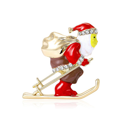 A red-suited Santa figure riding gold-tone skis shown on a white background