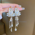 White Floral Pearl Stud and Hoop Earrings in Fourteen Styles view 10