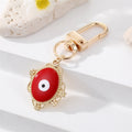 Gold Tone Filigree Oval Teardrop and Star Evil Eye Clip Keychains view 3