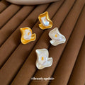 Abstract Pearl Inlay Stud Earrings with Distinctive Textured Details view 1