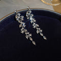 Silver Tone Crystal Leaf And Pearl Drop Earrings With Polished Metal Tone Details view 6