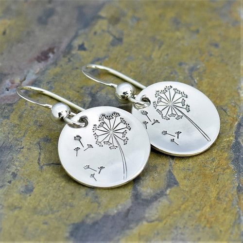 Second product view showing silver-tone engraved dandelion round-disc hook earrings