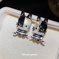 Black and White Cat Stud Earrings with Striped Bodies and Gold Details view 4