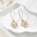 Gold Tone Quatrefoil Pressed Flower Drop Earrings in Six Designs view 7