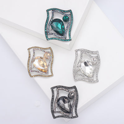 Front view of the wavy metal frame faceted glass brooch in four colorways brooch and its color options
