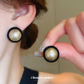 Round Pearl Center Black Rim Stud Earrings With Decorative Metal Accents view 1