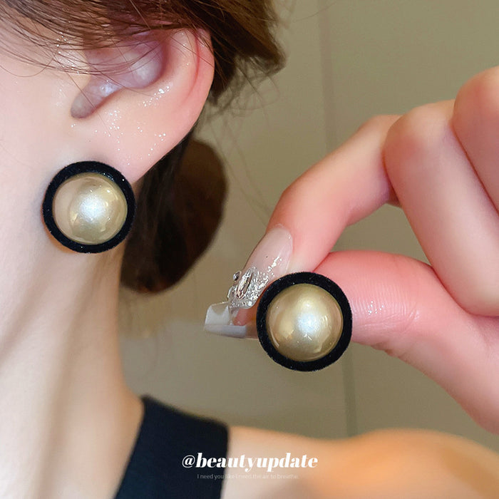 Round Pearl Center Black Rim Stud Earrings With Decorative Metal Accents