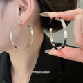 Oversized Polished Hoop Earrings with Distinctive Textured Details view 3