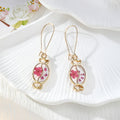 Gold Tone Candy-Shaped Pressed Flower Drop Earrings in Six Designs view 3