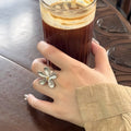 Silver Textured Five-Petal Flower Open Ring Gold Center view 2