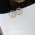 Round Opalescent Crystal Stud Earrings With Polished Metal Tone Details view 4