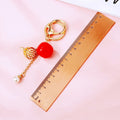 Persimmon Lotus and Pearl Charm Keychain with Braided Wrist Loop view 5