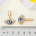 Crystal Lash Blue Evil Eye Huggie Earrings in Gold and Silver Tone view 4