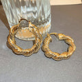 Gold Tone Textured Open Hoop Earrings with Polished Metal Finish view 2