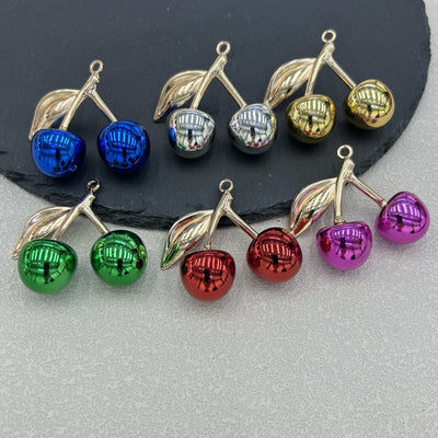 Six metallic cherry charms in blue, silver, gold, green, red and purple grouped together