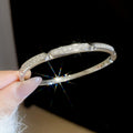 Crystal Pave Hinged Bangle Bracelets in Gold and Silver Tone view 3
