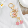 Cherry Charm Keychain with Enamel Butterfly and Daisy Flower Pendant view 10