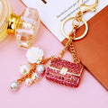 Crystal Mini Handbag Keychains with Pearl and Flower Dangles in Eight Options view 3