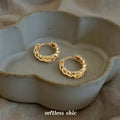 Gold Twisted Rope Huggie Hoop Earrings Polished Metal view 1