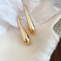 Sculptural Long Teardrop Stud Earrings in Silver and Gold Tones view 7
