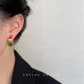Red Santa Hat Stud Earrings With Green Pom-Pom Drops view 2