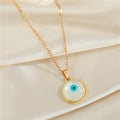 Gold Tone Round Pearl Blue Evil Eye Pendant Necklace and Earrings view 3