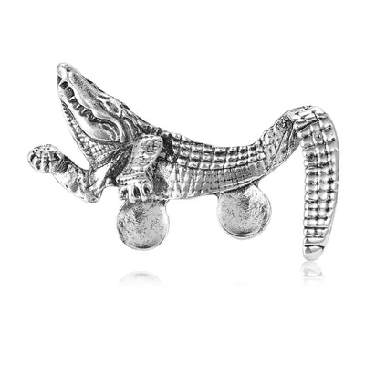 Silver cast metal crocodile brooch open jaws curled tail front