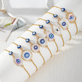 Gold Tone Blue Evil Eye Double-Dangle Slider Bracelets in Eight Designs view 1