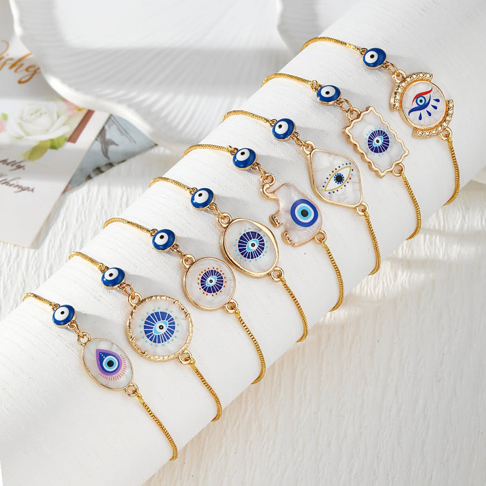 Gold Tone Blue Evil Eye Double-Dangle Slider Bracelets in Eight Designs
