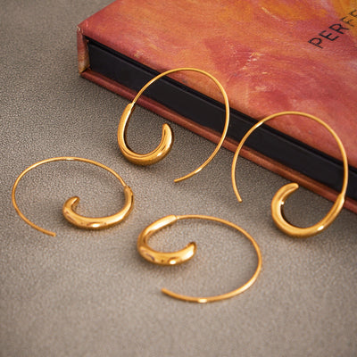 Display view of spiral wire hook C hoop earrings in main image 1.