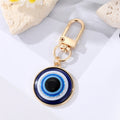 Gold and Silver Tone Round Blue Evil Eye Clip Keychains in Two Sizes view 3