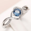 Blue Round Solitaire Wave Ring In Polished Silver Tone view 3