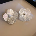 Silver Tone Sculpted Flower Stud Earrings with Polished Metal Accents view 6