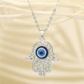 Crystal Hamsa Blue Evil Eye Pendant Necklaces in Two Finishes view 3