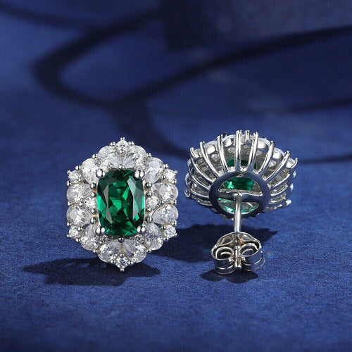 Front and openwork back of green halo studs with butterfly backs
