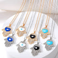 Gold and Silver Tone Crystal Hamsa Heart Eye Necklaces view 1