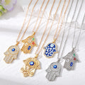 Gold and Silver Tone Hamsa Evil Eye Pendant Necklaces view 1