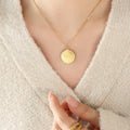 Gold Round Coin Pendant Necklace with Engraved Cherub Angel Motif view 6