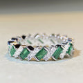 Green And Clear Baguette Woven Eternity Band In Silver Tone view 1