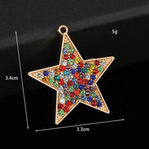 Gold-tone rainbow rhinestone star charm with printed size markers 3.4cm, 3.3cm and weight 5g
