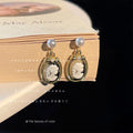 Gold Tone Pearl Top Black White Cameo Profile Medallion Drop Earrings view 4