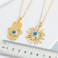 Gold Tone Hamsa Hand and Sun Blue Eye Pendant Necklaces view 5