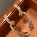 Curved Ribbon Clear Crystal Pavé Drop Earrings in Gold Tone view 2