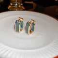 Green Crystal Geometric Hoop Earrings With Polished Metal Tone Details view 6