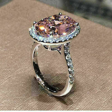 Pink Oval Solitaire Halo Ring In Polished Silver Tone