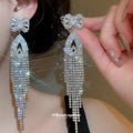 Crystal Bow Fringe Drop Earrings in Gold and Silver Tone view 4