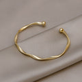 Twisted Metal Open Cuff Bracelet In Four Polished Colors view 1